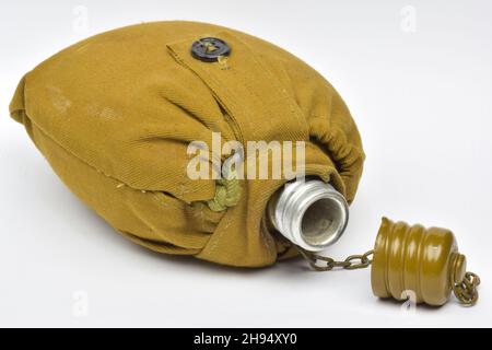 Military khaki lined liquid flask with open lid on chain on white clipping background Stock Photo