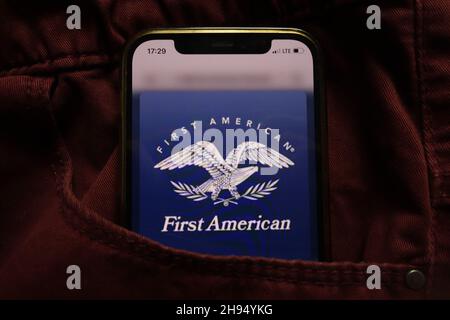 KONSKIE, POLAND - September 15, 2021: First American Financial Corporation logo displayed on mobile phone hidden in jeans pocket Stock Photo