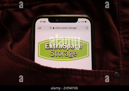 KONSKIE, POLAND - September 15, 2021: Extra Space Storage Inc logo displayed on mobile phone hidden in jeans pocket Stock Photo