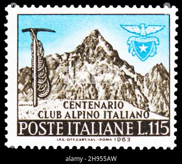 MOSCOW, RUSSIA - OCTOBER 24, 2021: Postage stamp printed in Italy shows Ax, rope, emblem of the I.A.C. and Monviso, circa 1963 Stock Photo