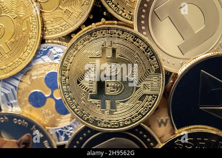 Bitcoin cryptocurrency coin close-up, on top of other cryptocurrency coins Stock Photo