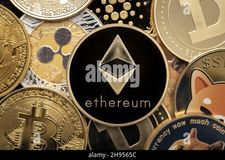 Ethereum cryptocurrency coin close-up, on top of other cryptocurrency coins Stock Photo