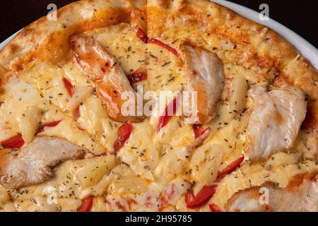 Pizza quattro stagioni four seasons pizza with cheese and chicken  Stock Photo
