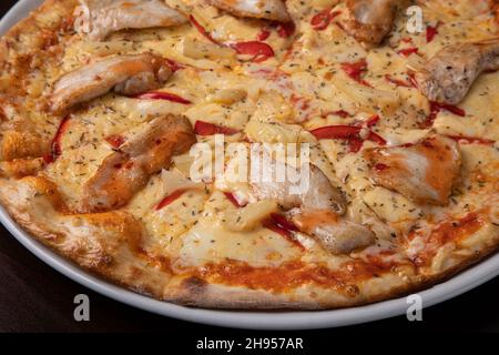 Pizza quattro stagioni four seasons pizza with cheese and chicken  Stock Photo