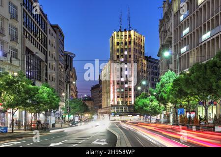 Night summer scene in Terazije square, featuring the historical highrise Palace Albanija in downtown Belgrade, Serbia. Stock Photo