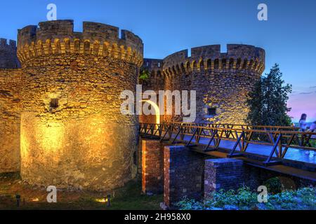 Night scene in Kalemegdan fortress in Belgrade, Serbia featuring the beautifully preserved Zindan Gate at sunset. Stock Photo