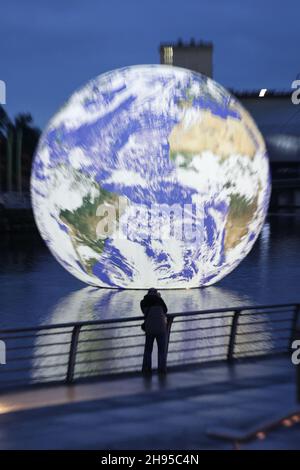 Salford, UK Luke Jerram's Floating Earth artwork at Lightwaves 2021 festival at Salford Quays on Friday 3rd December 2021. (Credit: MI News) Credit: MI News & Sport /Alamy Live News Stock Photo