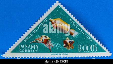 Photo of a green triangular postage stamp from Panama featuring illustrations representing the space vehicles from the Apollo moon missions Stock Photo