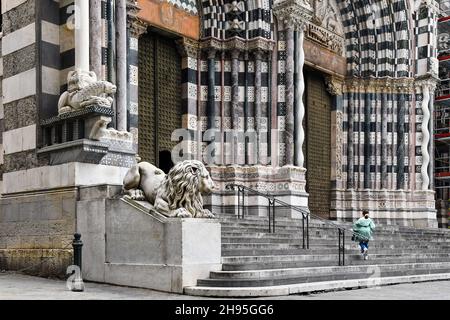 Outside of the medieval Cathedral of St Lawrence with the entrance staircase, the statues of the lions and the marble columns, Genoa, Liguria, Italy Stock Photo