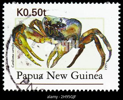 MOSCOW, RUSSIA - OCTOBER 24, 2021: Postage stamp printed in Papua New Guinea shows Brown Land Crab (Cardisoma carnifex), serie, circa 1995 Stock Photo