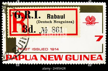 MOSCOW, RUSSIA - OCTOBER 24, 2021: Postage stamp printed in Papua New Guinea shows Surcharged registration label of New Guinea, 1914, 75th Anniversary Stock Photo