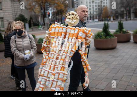 Frank Huntley has been trying to raise awareness of opiate addiction with his sculpture 'Pill Man. On December 3, 2021, people from across the United States, who lost loved ones due to the opioid epidemic, rallied at the Department of Justice in Washington DC, calling on Attorney General Merrick Garland and Deputy AG Lisa Monaco to bring criminal charges against members of the Sackler family. The Sackler's company, Purdue Pharma, pleaded guilty in October of 2020, to three criminal charges related to its marketing of the drug OxyContin but have only faced monetary penalties of around $8.3 bill Stock Photo