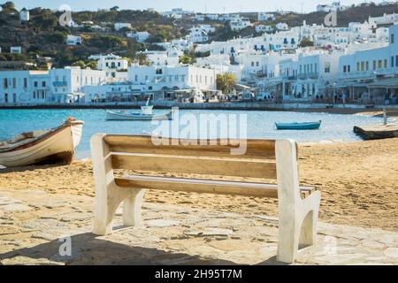 Wooden bench on the bench of Mykonos, Greece Stock Photo