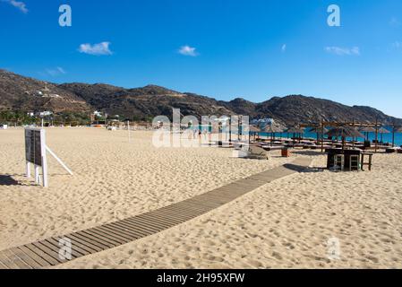 Beautiful Ios Island Greece. Secluded Mylopotas beach. Popular Greek holiday resort. View of large sandy shore.  Landscape aspect view with copy space Stock Photo