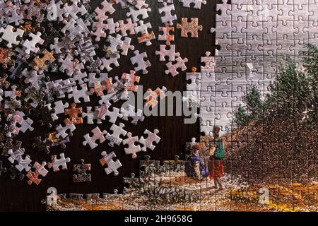 Colorful puzzle partially completed. Unfinished puzzle Stock Photo