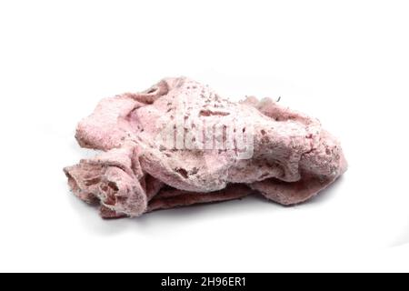 Old dirty torn rag isolated on white background. Cleaning rag. Stock Photo