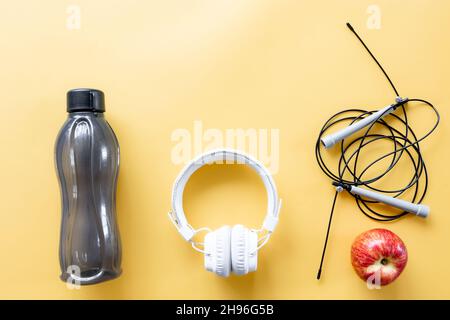 Flat lay composition with sports equipment on yellow background. Stock Photo