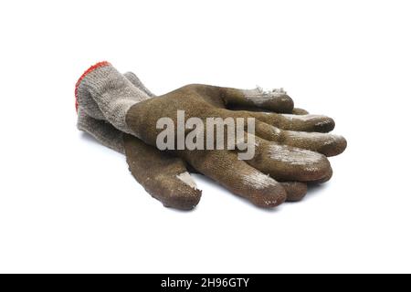 Used old dirty torn worker's gloves isolated on white background. Stock Photo