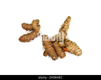 Fresh turmeric roots isolated on white background. Sliced fresh turmeric. Stock Photo