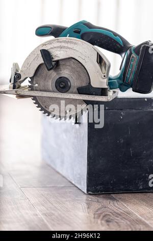 An electric Circular saw on blurred background. Stock Photo