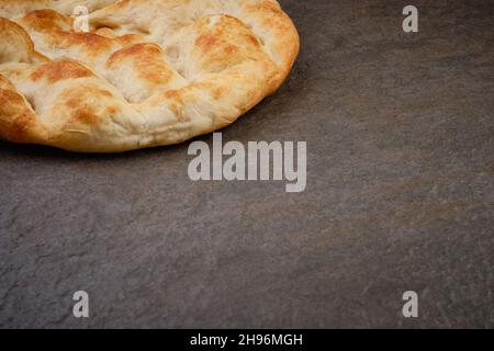 Pita bread on stone table surface Stock Photo