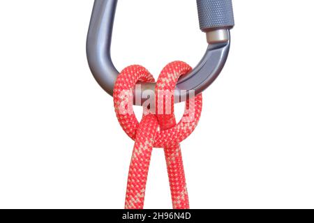 Clove hitch tied with red rope on carabiner, isolated on white background. This clove hitch knot used in climbing is called Mastwurf in German and Noe Stock Photo