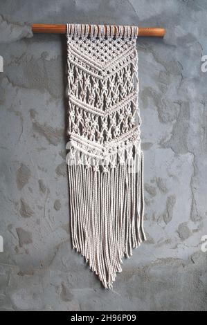 Beautiful boho wall panel in macrame style to create a cozy atmosphere Stock Photo