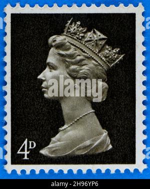 Photo of a black postage stamp 4d with Queen Elizabeth II in profile Stock Photo