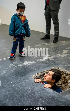 Beijing, China. 05th Dec, 2021. Man looking out of underground tunnel at Maurizio Cattelan The Last Judgment art exhibition in UCCA Center for Contemporary Art in Beijing, China on 05/12/2021 by Wiktor Dabkowski Credit: dpa/Alamy Live News Stock Photo