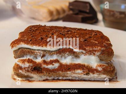 The classic homemade tiramisu is the Italian dessert par excellence, one of the most delicious and well-known in the world. Mascarpone cream and coffe Stock Photo