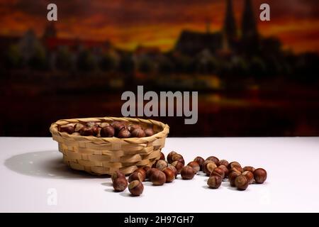 hazelnuts in a basket on a white background Stock Photo