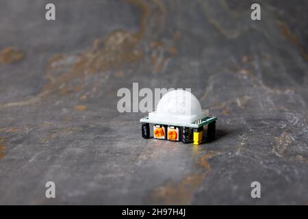 A closeup shot of an HC-SR501 PIR motion sensor module Stock Photo