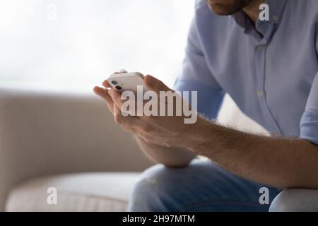 Close up hands of user using app on mobile phone Stock Photo