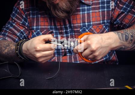 Leather master at work at studio Stock Photo