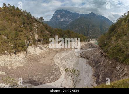 Road bridge over braided stream that runs through a valley, Dolomites, Italy