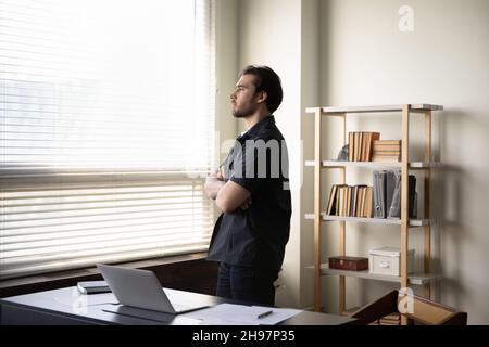 Serious thoughtful business man thinking over company future in office Stock Photo