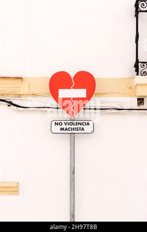 Heart-shaped traffic sign with spanish inscription "NO VIOLENCIA MACHISTA" (in engl. non-sexist violence) Stock Photo