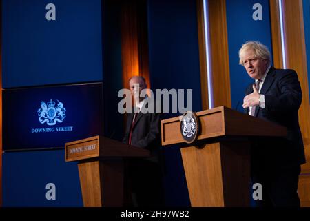 LONDON, ENGLAND, UK - 27 November 2021 - British Prime Minister Boris Johnson holds Covid-19 press conference alongside Chris Whitty, Chief Medical Of Stock Photo