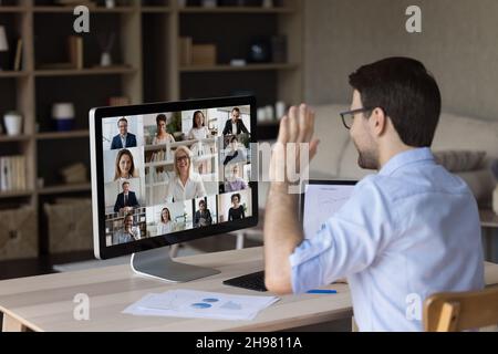 Millennial office employee meeting, talking to business team Stock Photo