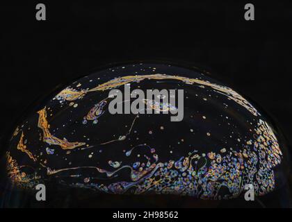Beautiful psychedelic abstractions on the surface soap bubbles. Stock Photo