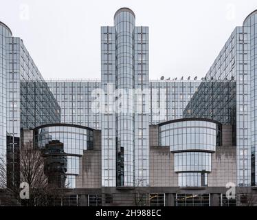 Brussels city center / Belgium - 04 27 2019: Contemporary facade of the round shaped tower of the European Parliament in the Leopold European district Stock Photo