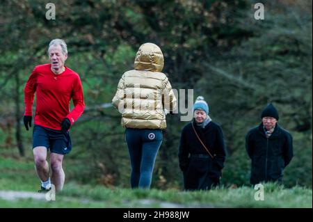 London, UK. 5th Dec, 2021. Drizzly weather in Hampstead doesnt stop people exercising on Hampstead Heath and enjoying the views of the city of london. Credit: Guy Bell/Alamy Live News Stock Photo