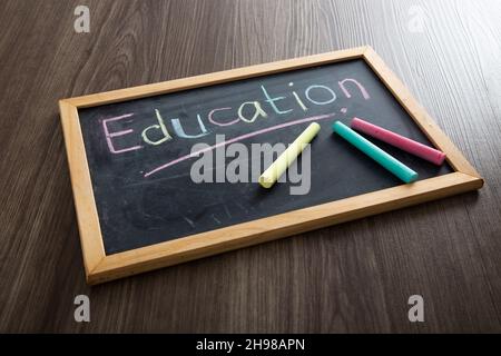 The word Education written on blackboard. Education Conceptual Stock Photo