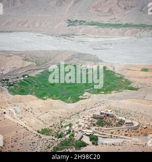 Aerial view of Buddhist temple monastery Key (Ki Gompa) on a high cliff overlooking the confluence of Pin Rivers and Spiti Valley at Indian Himalayas, Himachal Pradesh, India. Landscape photography Stock Photo