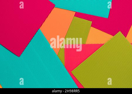 Abstract geometric background in color pastel tones from sheets of  embossed paper, cardboard. Suitable as design element, separate project, cover for Stock Photo