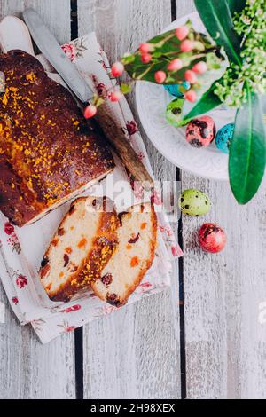 Easter citrus cake with dried fruits for holiday on wooden table background. Copy space, vertical, image Stock Photo