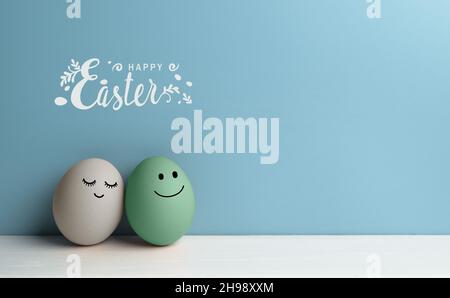 Pair of easter eggs with loving faces with happy Easter lettering Stock Photo