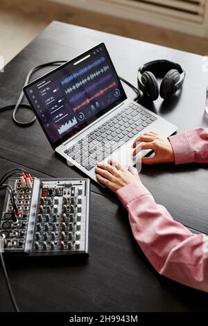 Top view close up of female creator setting up recording equipment in studio, copy space Stock Photo