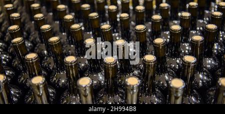 Wine bottles tops with corks, soft focused background Stock Photo