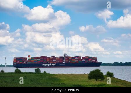 Containership on River Elbe near Krautsand, Lower Saxony, Germany Stock Photo